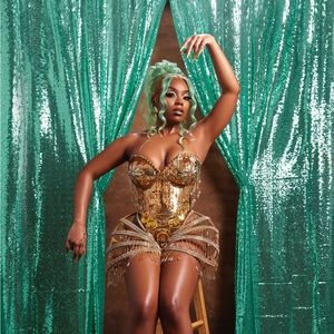 Custom gold bodysuit skirt costume.